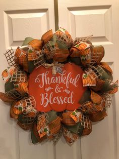 a wreath that says, grateful and is decorated with pumpkins