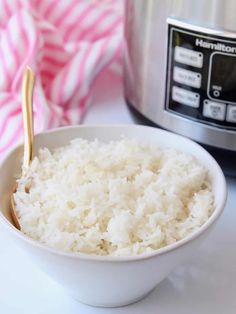 rice in a bowl next to an instant pot