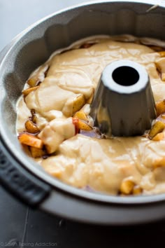 a pan filled with food sitting on top of a table