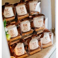 a stack of cookies sitting next to each other on top of a wooden table covered in brown ribbon