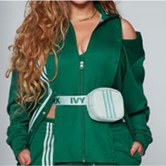 Beyonce’s Own Imprint Ivi Park And Adidas Have Come Together To Upgrade Your Sports Outfit. This Adidas X Ivy Park Track Jacket Takes On The Iconic Firebird Track Jacket Is What We Call A Successful Update. Snap Buttons Down The Front Mixed With A Sophisticated High Collar, This Unisex Piece Has All The Tools To Join Your Three-Striped Collection. - Adidas Ivy Park 4all Track Jacket Dark Green - Regular Fit - Full Zip With Ribbed Stand-Up Collar - Snap-Button Front Panels - Ribbed Cuffs And Hem Adidas Ivy Park, Adidas X Ivy Park, Sports Outfit, Green Sweatshirt, Ivy Park, Adidas X, Firebird, Track Jacket, Track Jackets