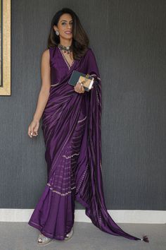 Violet hand embroidered saree with floral and linear detailing. Comes with blouse.
Component: 2
Pattern: Embroidery
Type Of Work: Floral, Ada Line
Neckline: Plunge V
Sleeve Type: Sleeveless
Fabric: Silk, Chanderi
Color: Purple
Other Details: 
Tassel detailing
Occasion: Wedding - Aza Fashions Sleeveless Blouse And Saree, Diwali Outfits Saree, Saree For Best Friends Wedding, Latest Silk Saree Trends 2024, 2024 Saree Trends, Violet Saree Blouse, Violet Blouse Designs, Violet Blouse Designs For Saree, Saree For Friends Wedding