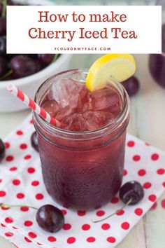 cherry iced tea in a mason jar with lemon wedges and cherries on the side