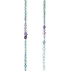 the long beaded necklace with multicolored beads is hanging on a white background