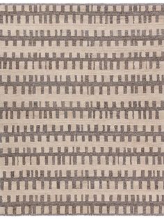 an area rug with grey and white stripes on the side, in front of a white background