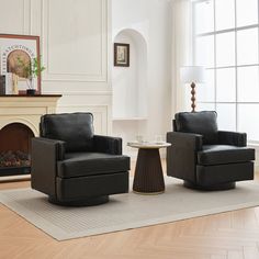 a living room with two chairs and a table in front of a fire place on the floor