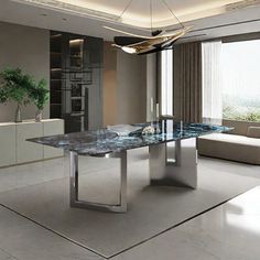 a modern dining room with marble table and white couches