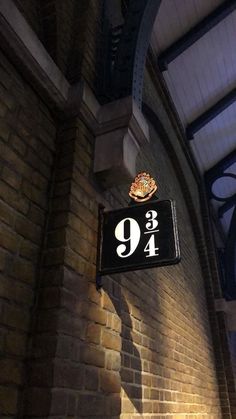 there is a sign on the wall that says 9 / 4