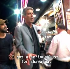 two men standing next to each other in front of a tv screen with the caption i got a serious just for shawama