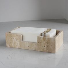 a marble desk set with a notepad and pen in the middle, on a white countertop