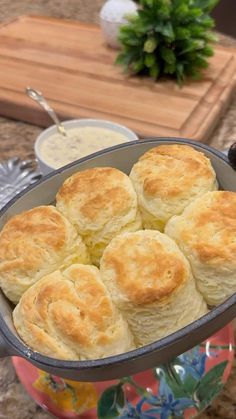 a pan filled with biscuits sitting on top of a counter