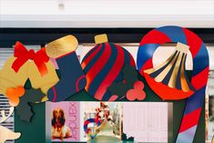 an assortment of colorful paper cutouts on display