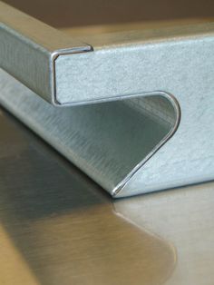 a close up view of a metal object on a table with no one around it