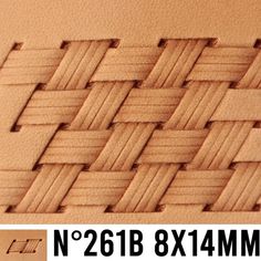 a close up view of a woven piece of wood with lines on the bottom and sides