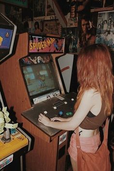 a woman playing an old school video game