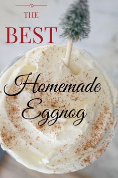 the best homemade eggnog recipe in a glass with a small tree on top