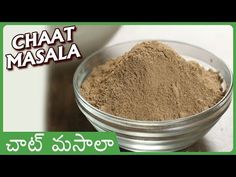 a glass bowl filled with sand next to a green and white sign that says ghaat masala