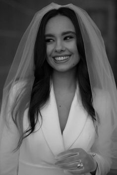 black and white photograph of a smiling bride