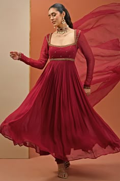 This exquisite Maroon Embroidered Georgette Anarkali Set exudes elegance and traditional charm. Crafted from premium georgette fabric, the full-sleeved maroon anarkali features intricate handwork on the neckline and waistline. Paired with a delicate organza churidar and a matching sheer dupatta adorned with subtle embellishments, this outfit combines sophistication with comfort. Perfect Anarkali for occasions like home poojas, family gatherings, or festive celebrations Composition : Anarkali, Churidar - Georgette, Dupatta - Organza and Lining - Semi crepe Care: Dry Clean Only and Vacuum Storage This product can be customized for sleeves, blouse length and neckline Delivery : 4-6 weeks as the product is hand crafted. Check Size Guide or choose MySize for free customisation (All Sizes above Hand Designs For Anarkali, Net Fabric Anarkali Dress, Chiffon Anarkali Suits, Anarkali Dress Pattern New 2024, Anarkali Look For Wedding, Organza Dress Pattern, Anarkali Dress Pattern New, Georgette Dress Indian, Maroon Anarkali Dress