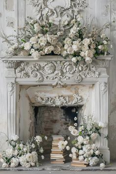 a white fireplace with flowers and books on it