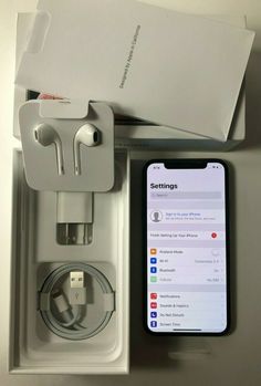 an iphone and earphones in a box