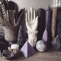 a table topped with lots of different types of items on top of a wooden table