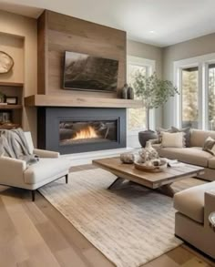 a living room filled with furniture and a fire place in the middle of the room