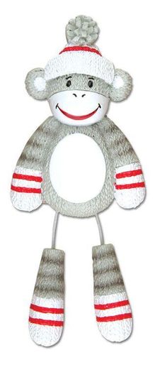 a sock monkey toy with red and white stripes