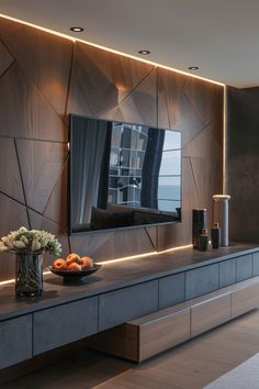 a modern living room with wood paneling on the wall and a large mirror above it