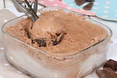 chocolate ice cream in a glass dish with spoons