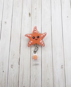 "Starfish Badge Reel  This little starfish is made with a beautiful coral color glitter. Glitter and details sealed with resin for a smooth long lasting finish and shine! Pearl accents are 3D! Measures approximately 2\" wide by 2\" tall. This is made to hold ID badges, choose from an alligator swivel clip, belt clip, MRI safe badge clip, or lanyard - see listing photos for examples of each! ⭐️ Alligator Swivel Clip ⭐️  Most popular option! The swivel spring clip on the back of the reel provides Clip Belt, Cute Badge Reel, Nurse Badge Holders, Non Ferrous Metals, Id Badge Holders, Belt Clip, Badge Holder, Snap Backs, Id Badge