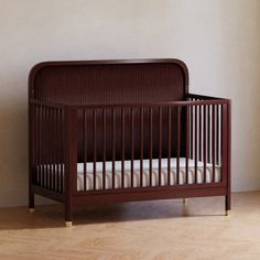 a baby crib in the corner of a room