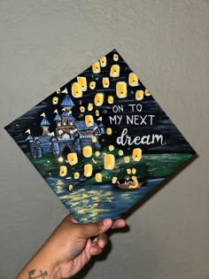 someone is holding up a graduation cap that says on to my next dream