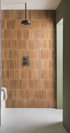 a bathroom with tiled walls and floor