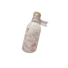 a bottle of hand sanitizer with pink flowers on the front and white background