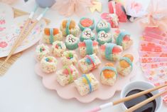 rice krispy treats are arranged on a plate with chopsticks