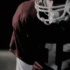 a football player wearing a uniform and helmet