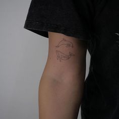 a person with a tattoo on their arm