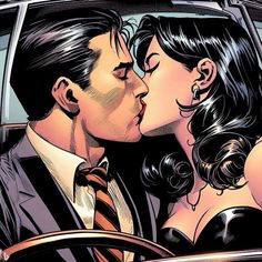 a man and woman kissing in the back of a car