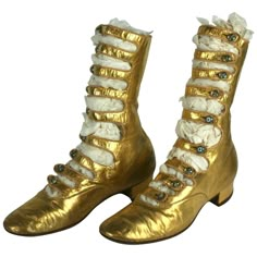 Exceptional and rare French Art Deco Gold Kid Boots. Of fine gold kid leather with high multi strapped instep closed with Tiffany style art glass iridescent shoe buttons. Sole stamped "Franks", which was a fine importer in the period. Excellent Condition overall. High 9" Length 9" heel -Toe Instep 6.50" Art Deco Shoes, Iridescent Shoes, Baroque Dress, Historical Shoes, Lizzie Hearts, 1910s Fashion, Gold Boots, Art Deco Gold, Art Outfit