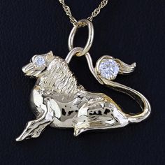 This Pendant Is Made Of 14 Karat Yellow Gold & Depicts A Lion Laying Down With 2 Diamonds (1/4 Ctw Worth), One Set As An Eye And The Larger One Set On The Tail. This Piece Is 27mm Wide And Is In Good Condition, Overall. **Chain Not Included** Size: Os Weight: 3.00dwt/4.67g Length: 26.75 Mm Metal: 14 Karat Yellow Gold Stone: Diamond (1/4ctw) 821748* E-615 Payment Receipt, Gold Lion, A Lion, Gold Stone, Fine Jewellery Necklace, One Set, An Eye, Diamond Pendant, Womens Jewelry Necklace