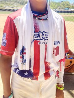 a young boy wearing an american flag scarf