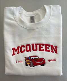 Cars Lightning Crewneck Sweatshirt Embroidered McQueen  Gildan® - Heavy Blend™ Crewneck Sweatshirt 8-ounce, 50/50 cotton/poly 60/40 cotton/poly (Heather Sports) Double-needle stitching at waistband and cuffs 1x1 rib knit collar, cuffs and waistband with spandex Lightning Mcqueen T Shirt, Spider Man Crewneck, Lightning Mcqueen Disney Outfit, Lightning Mcqueen Sweatshirt, Lightning Mcqueen Hoodie, White Machine Embroidered Tops For Streetwear, Sporty Crew Neck Sweatshirt With Machine Embroidery, Machine Embroidered Crew Neck Top For College, Crew Neck Top With Machine Embroidery For College