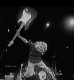 black and white photograph of a man playing guitar