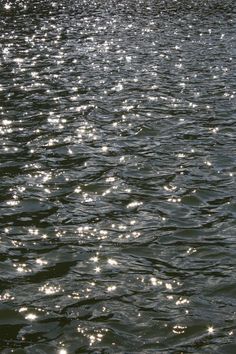 the sun shines on the water as it reflects off the surface of the water