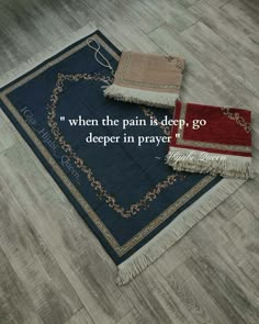 two rugs sitting on top of a wooden floor with a quote written in the middle