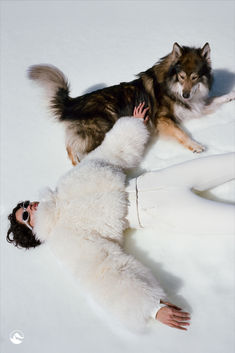 Model laying in snow with beautiful dog with brown and tan fur. She is wearing silver small oval sunglasses and a beautiful cream ski suit with shearling fur top Ski Apparel, Luxury Ski, Ski Fashion, Skiing Outfit, Sports Models, Winter Sport, Ski Suits, Feel Beautiful, Creative Studio