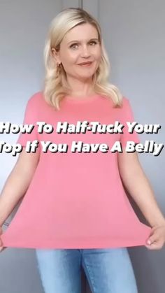 a woman standing in front of a mirror with the words how to half - tuck your top if you have a belly