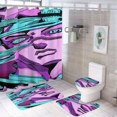 a bathroom with purple and blue designs on the shower curtain, toilet and rugs