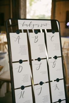 the seating cards were placed on top of each other to display their names and numbers